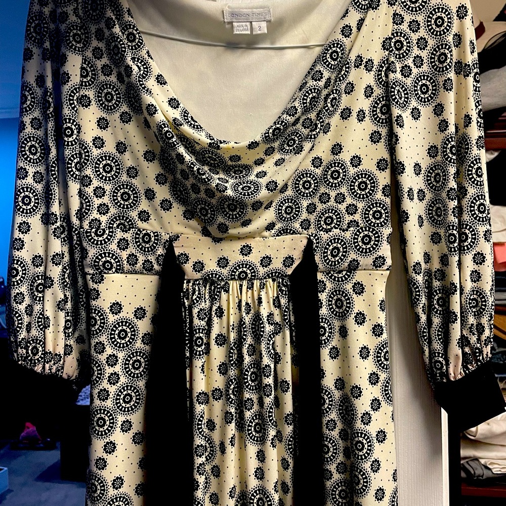 Cute cream, black shirt dress. Falls right above the knee, empire waist style